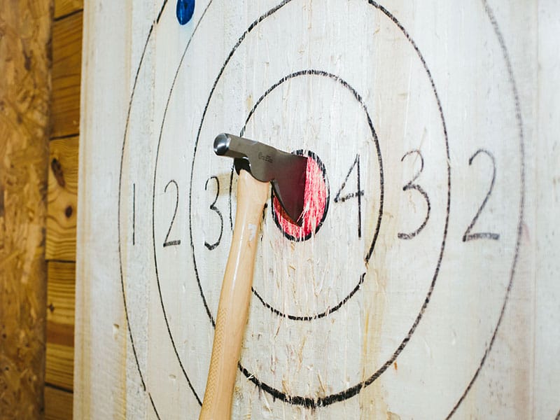 axe embedded in a target bullseye